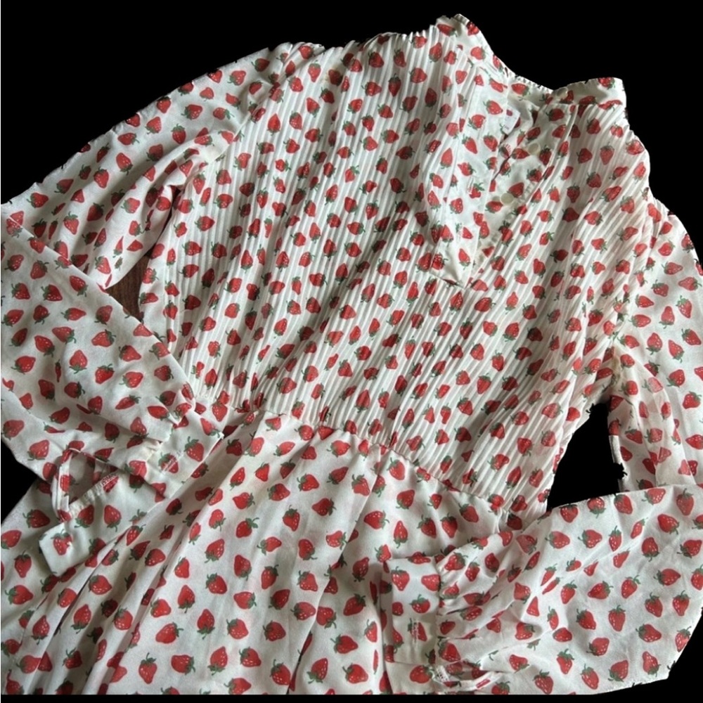 Strawberry print knee length dress. Pleated top half. Fits USW6-8